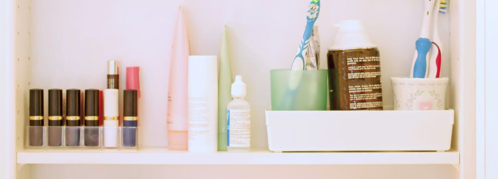 Bathroom cabinet filled with household objects